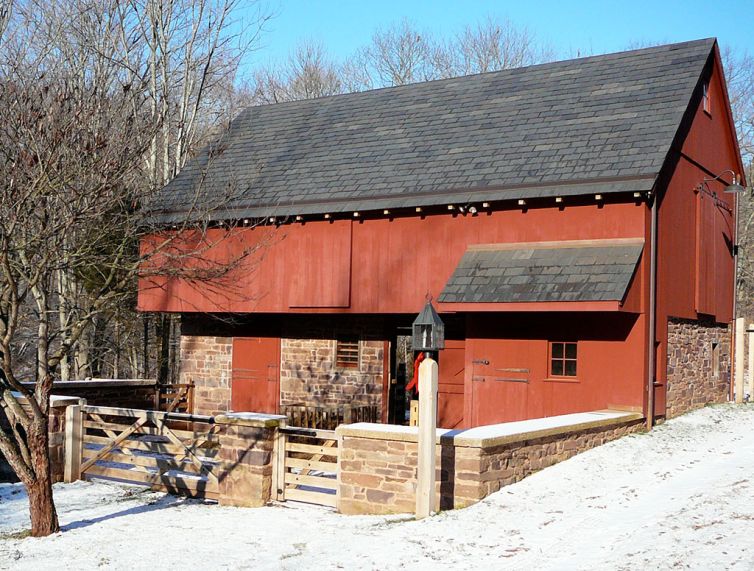 Stone barn with stone foundation and red siding
