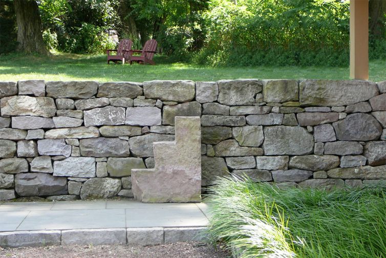 Solid stone wall with stone steps