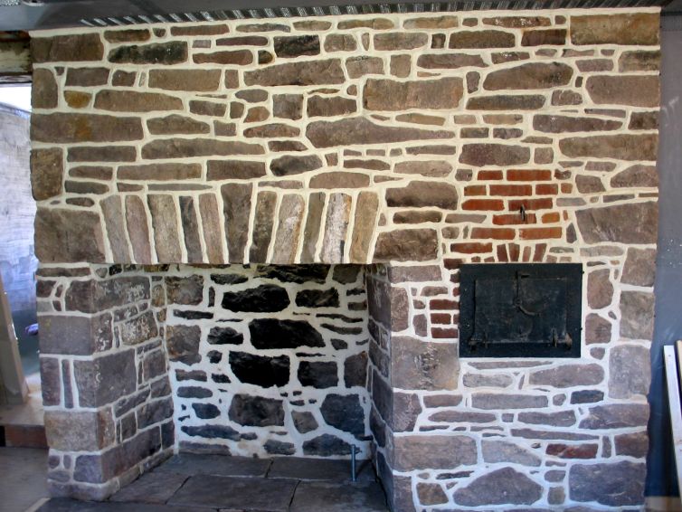 Stone fireplace with ridge pointing