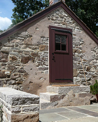Stone garage with solid stone steps