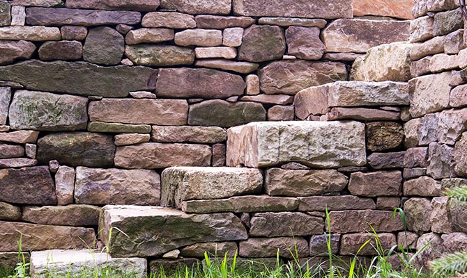 Stone wall with solid stone steps