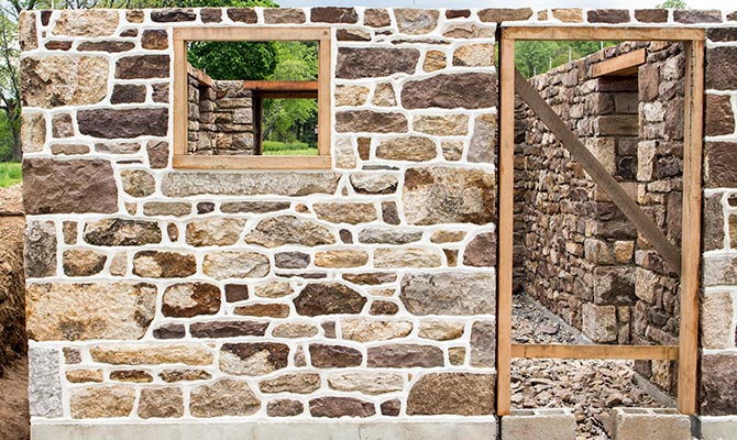Stone barn foundation with new window and door openings