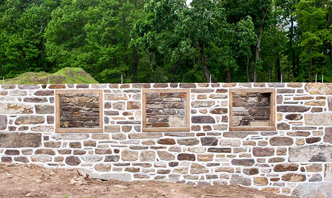 Stone barn foundation with ridge pointing